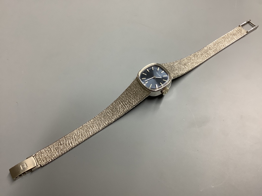 A lady's modern 9ct white gold Tissot manual wind wrist watch, on integral Tissot 9ct white gold bracelet, 17.5cm